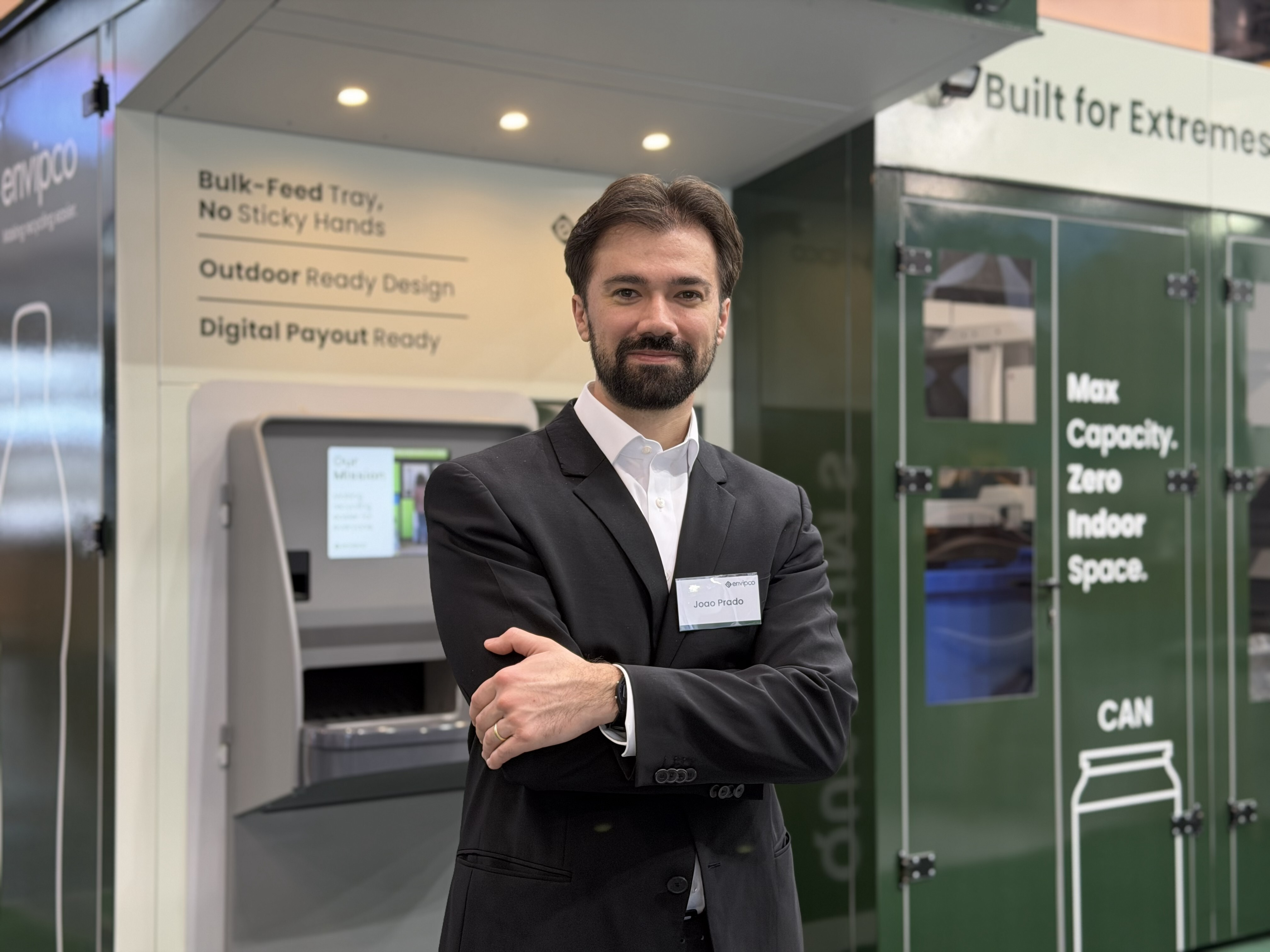 Person standing in front of a bulk reverse vending machine (Quantum)